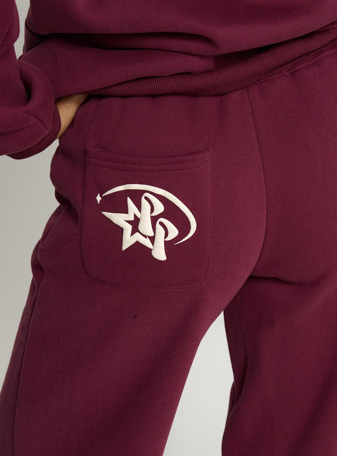 back view of model wearing Princess Polly Princess Polly Stargirl Wide Leg Sweat Pants Burgundy High Rise Pants 