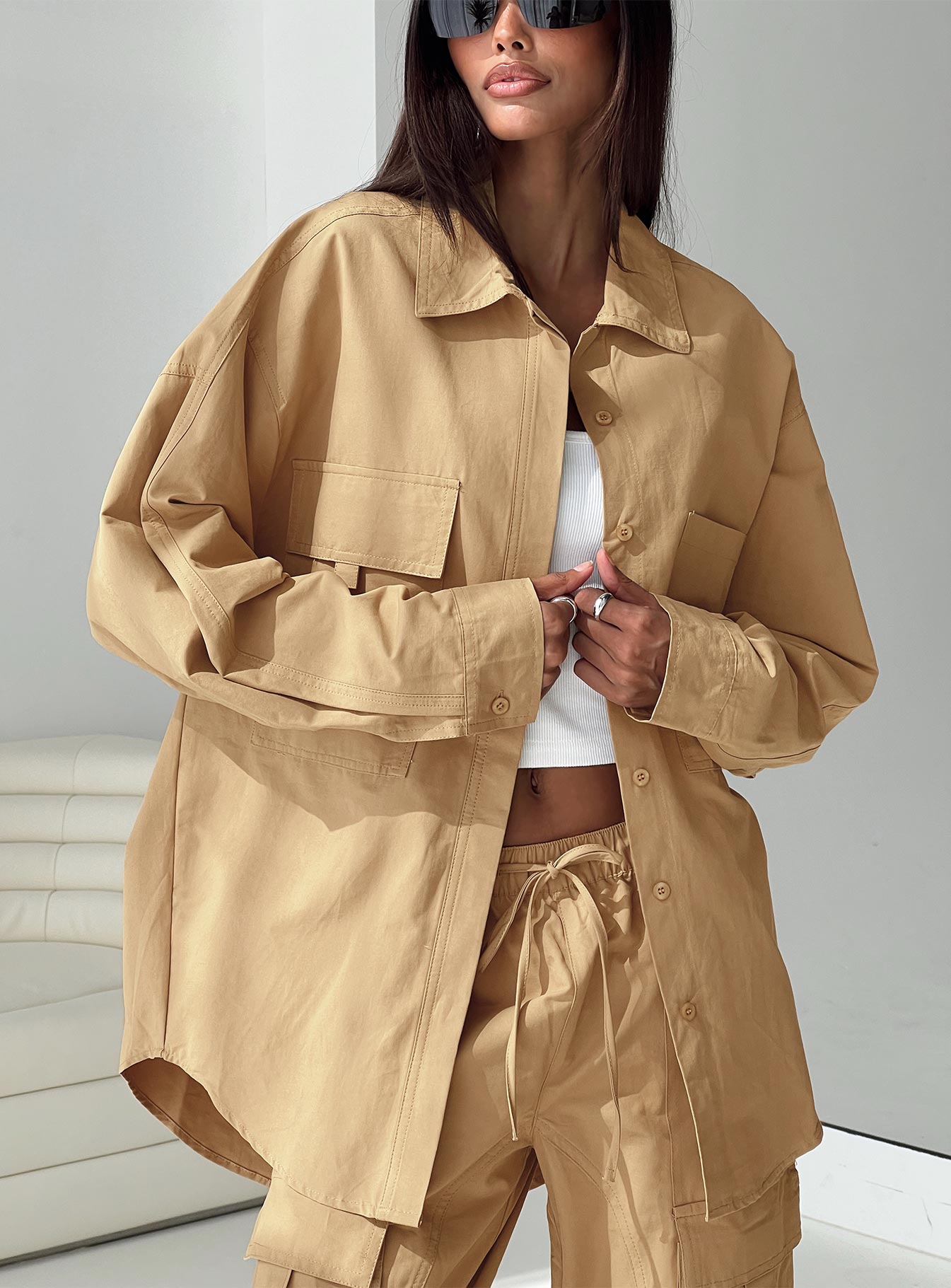 Front view of model wearing  front Princess Polly High Waisted Pants  Bilbury Cargo Pants Caramel