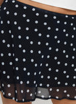 back view of model wearing Princess Polly Dapple Bias Mini Skirt Black Polka Dot Mini Skirts 