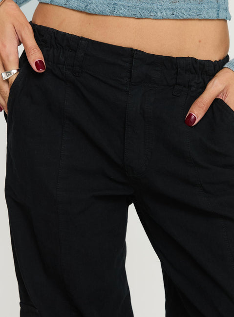 back view of model wearing Princess Polly Chicker Mid Ride Pants Black Low Rise Pants 