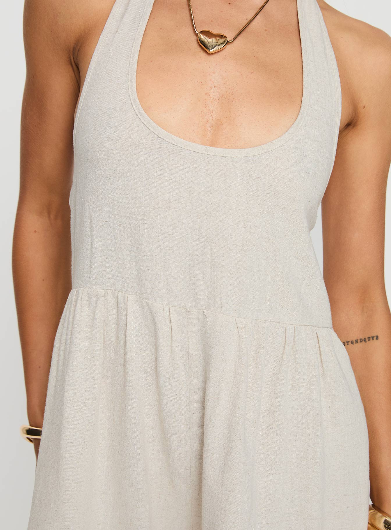 Romper Halter neck tie fastening, scooped neckline, low back, invisible zip fastening at side, twin hip pockets Non-stretch, unlined