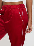 back view of model wearing Princess Polly Travalta Satin Track Pant Red Low Rise Pants 