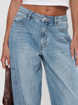 front view of model wearing Princess Polly Ringer Low Rise Wide Leg Jeans Blue Mid Rise 