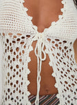 Halter top Crochet style, plunging neckline, tie fastening at bust, split hem Non-stretch material, unlined, sheer