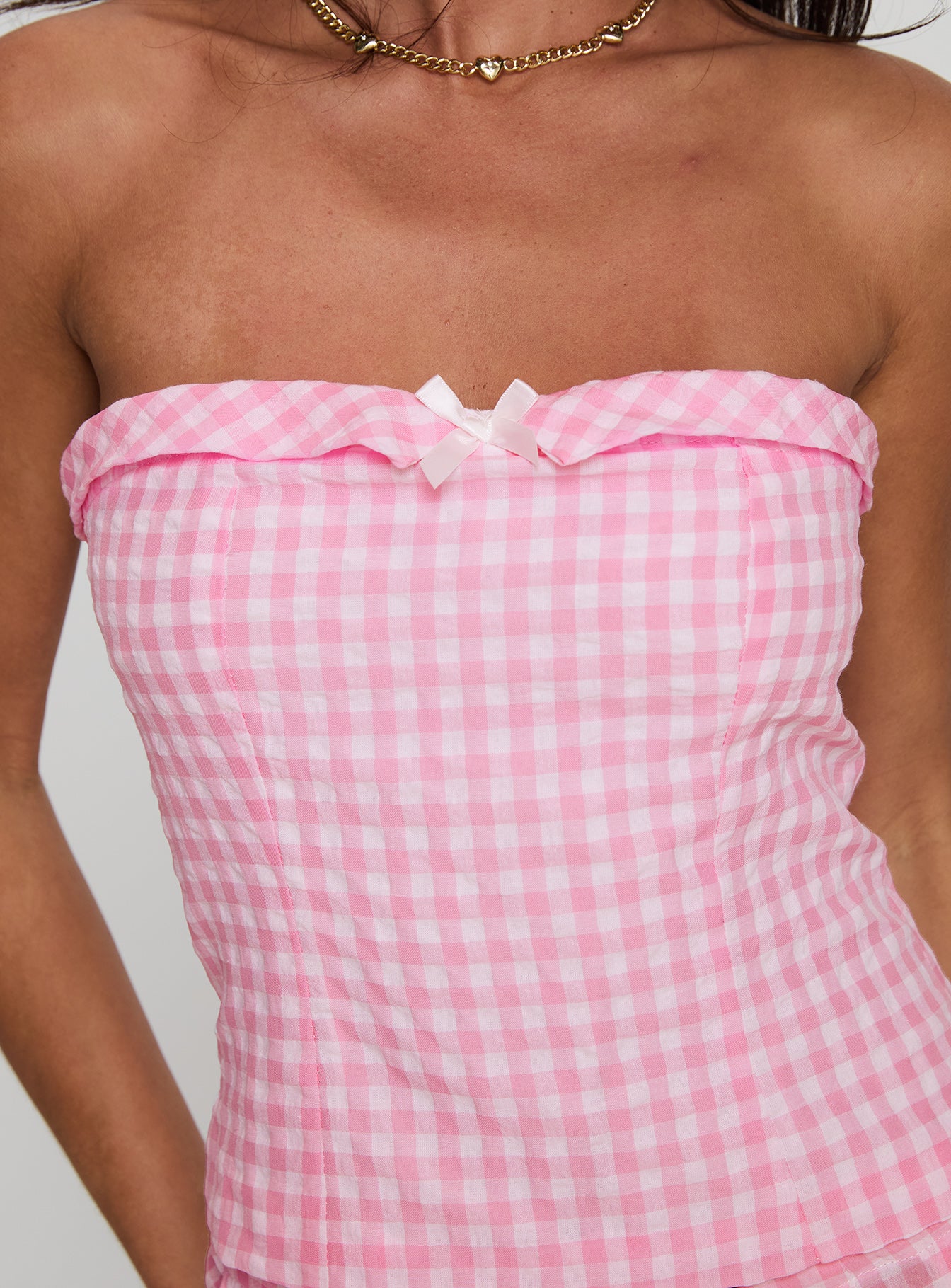 back view of model wearing Princess Polly Carmino Strapless Top Pink Check Sleeveless straight 