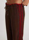 side view of model wearing Princess Polly Maranie Pants Brown / Red Low Rise Pants 