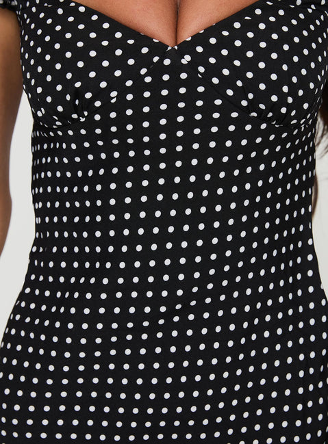 back view of model wearing Princess Polly Moretti Mini Dress Black Polka Dot Sweetheart Neckline 