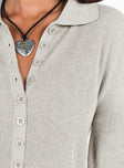 Romper Knit material  Classic collar  Button front fastening Drop shoulder  Raw cut hem 