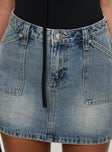 back view of model wearing Princess Polly Precious Cargo Denim Mini Skirt Light Blue Wash Mini Skirts 