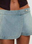 back view of model wearing Princess Polly Down For The Ride Denim Skort Light Wash Low Rise Shorts 