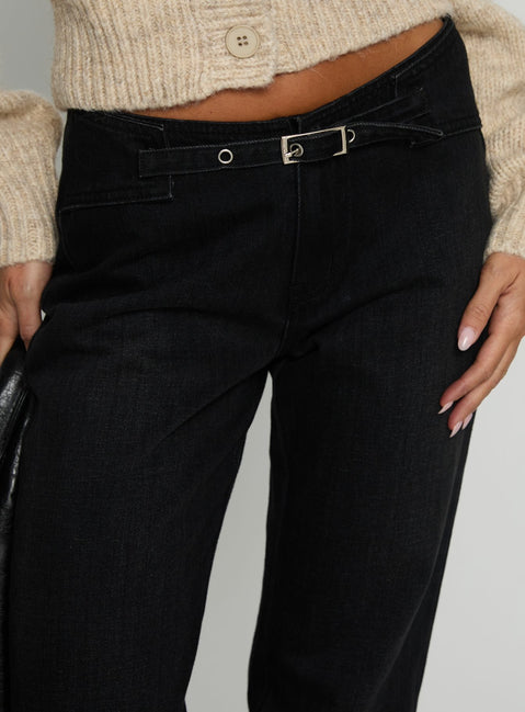 back view of model wearing Princess Polly Slow Ride Mid Rise Bootleg Belted Jeans Washed Black Mid Rise Jeans 