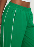 side view of model wearing Princess Polly Field Day Track Pants Green High Waisted Pants 