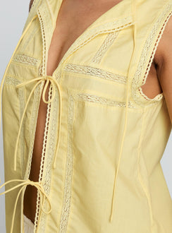 back view of model wearing Princess Polly Angourie Blouse Top Lemon Sleeveless Crew Neck 