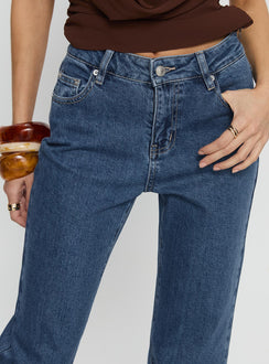 front view of model wearing Princess Polly Magic Mirror Mid Rise Bootleg Jeans Mid Blue Wash Mid Rise Jeans 