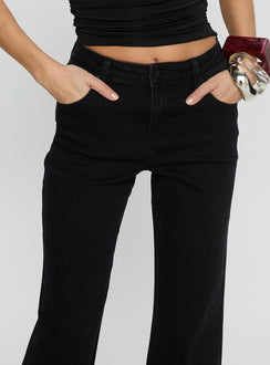 back view of model wearing Princess Polly Magic Mirror Mid Rise Bootleg Jeans Washed Black Mid Rise Jeans 