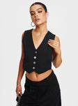 Front view of model wearing  front Princess Polly Sleeveless V-Neck  Lavine Vest Top Black