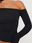 Front view of model wearing  front Princess Polly Full Sleeves Asymmetric Neckline  Vito Cold Shoulder Top Black