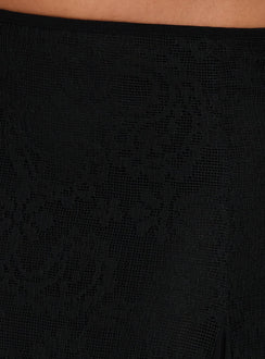 Highlighting the Quani Lace Midi Skirt Black womens-skirts with solid print and intricate lace hem detailing Princess Polly