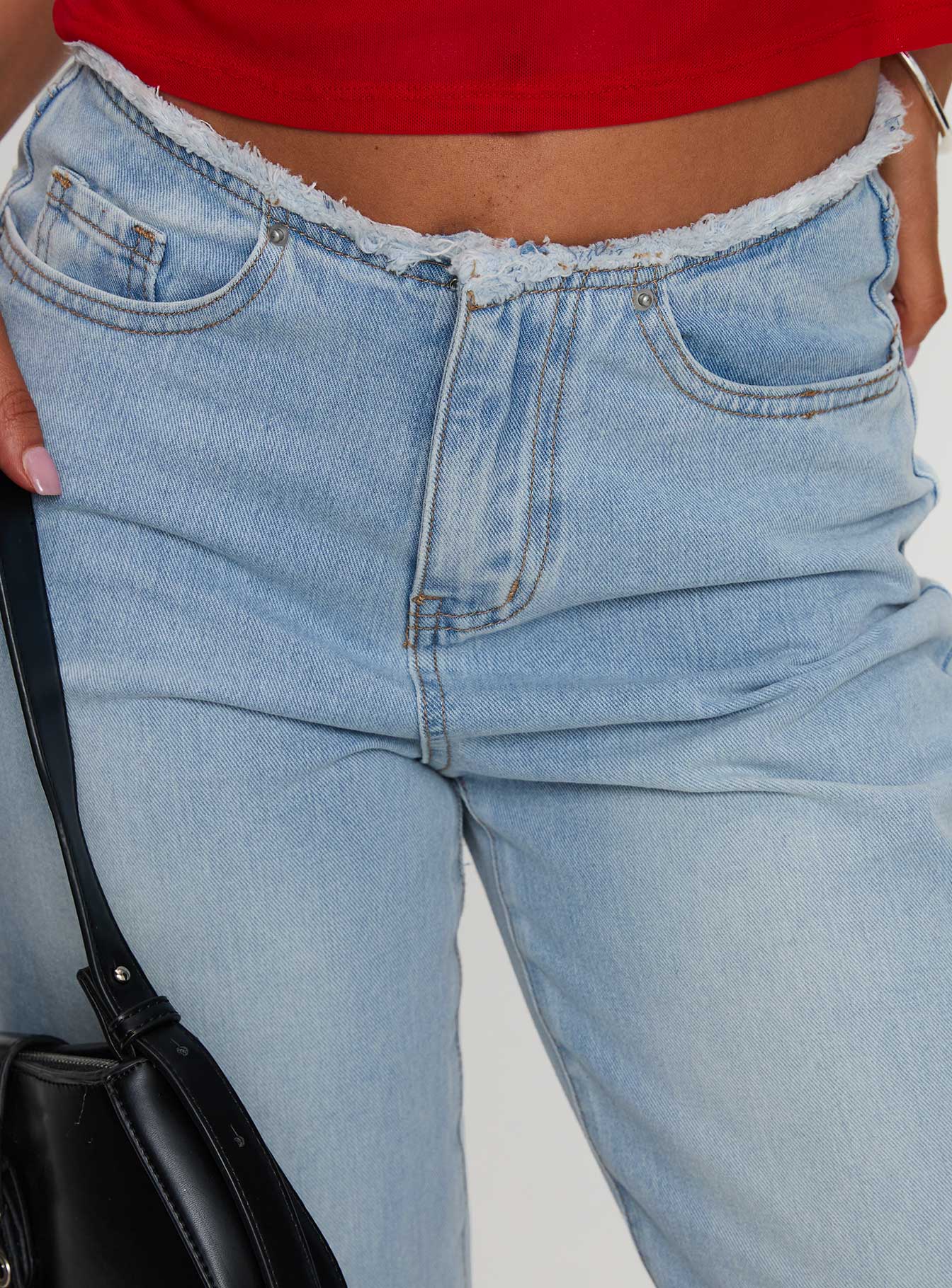 back view of model wearing Princess Polly Hawke Frayed Jeans Mid Blue High Waisted 