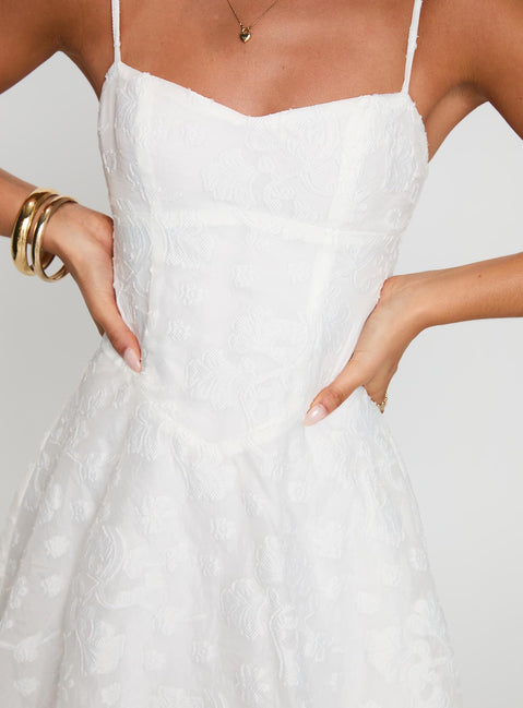 back view of model wearing Princess Polly New Chapters Broderie Mini Dress White Sweetheart Neckline 