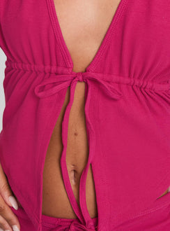 back view of model wearing Princess Polly Obviously Halter Top Pink Sleeveless Plunger 