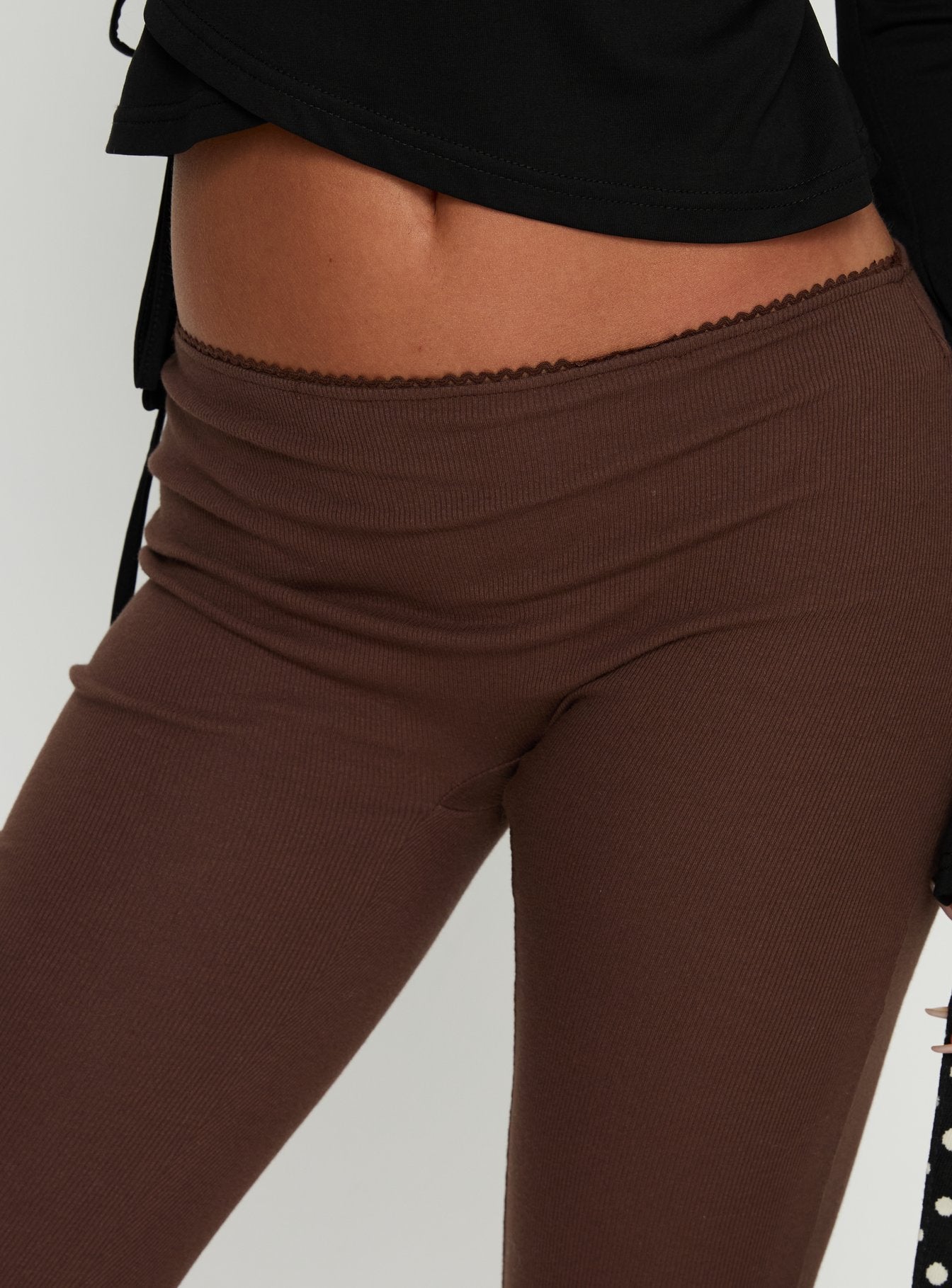 back view of model wearing Princess Polly Baseline Rib Capri Pants Chocolate Mid Rise Pants 