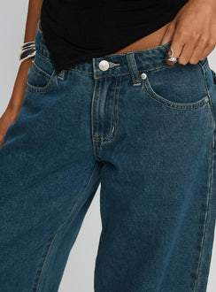 front view of model wearing Princess Polly Juda Mid Rise Barrel Leg Jeans Mid Blue Wash High Waisted Jeans 