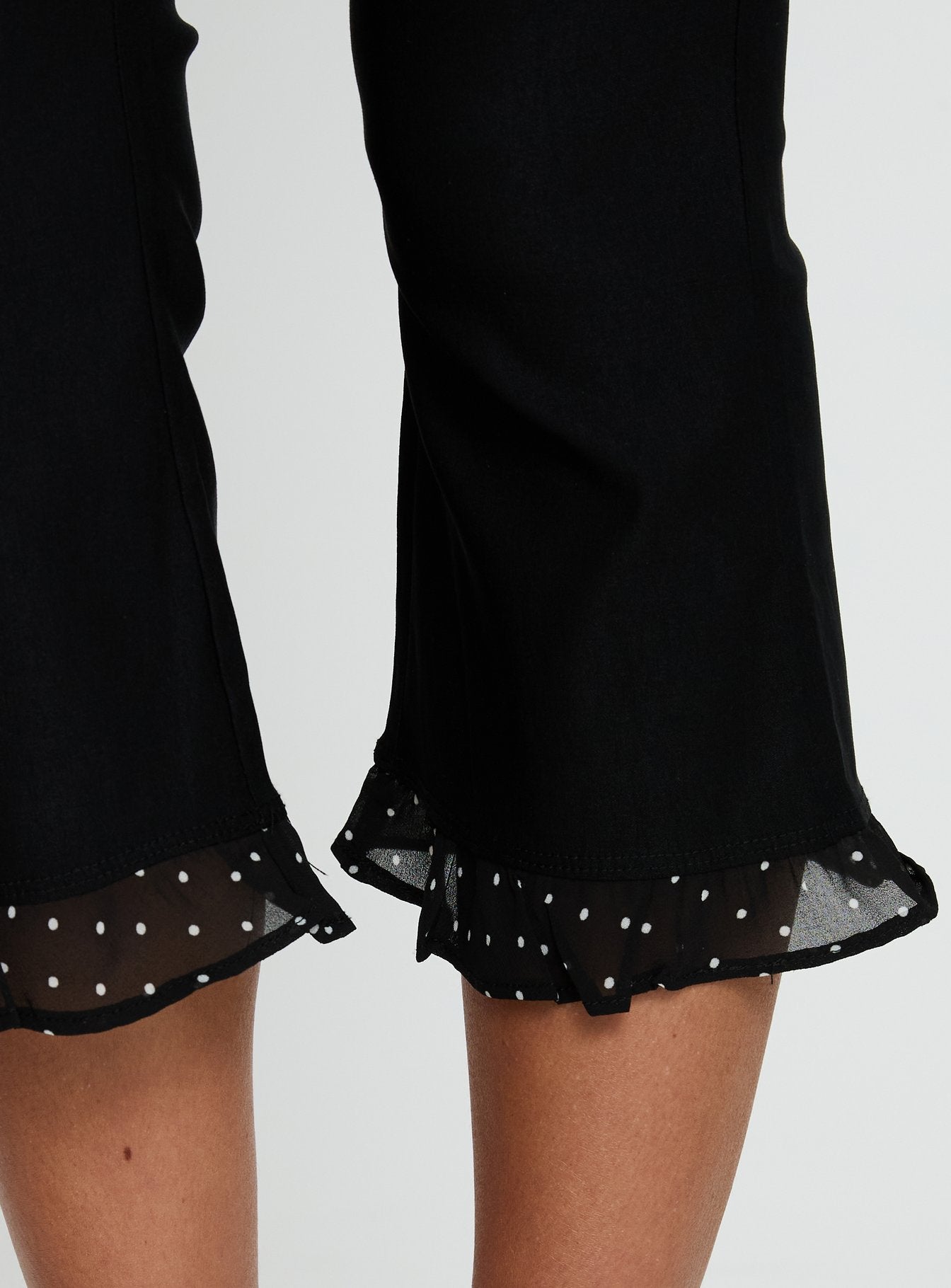 back view of model wearing Princess Polly Darsie Frill Capri Black Polka Dot High Rise Pants 