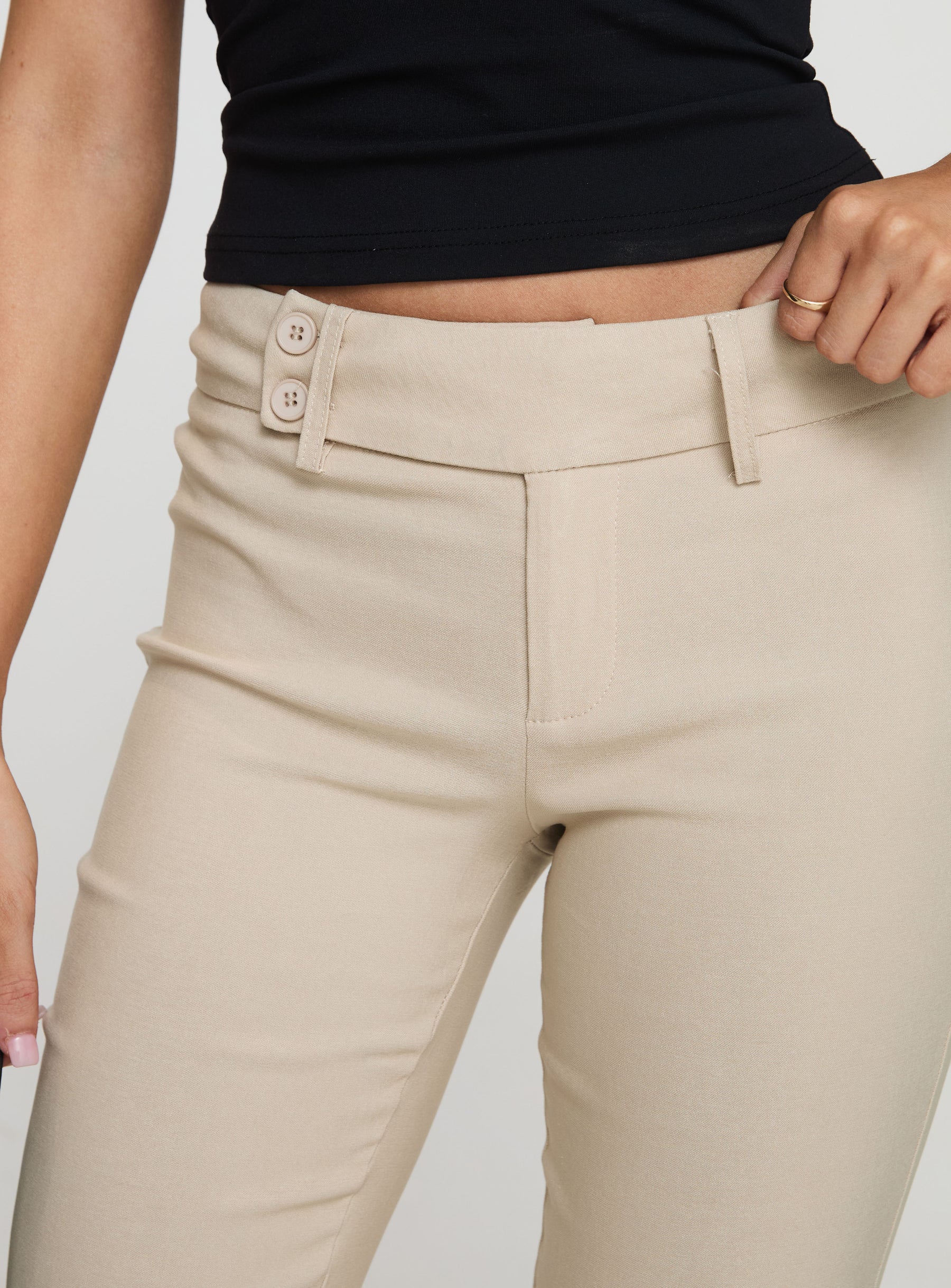 back view of model wearing Princess Polly Kinkirk Flared Pants Taupe Low Rise Pants 