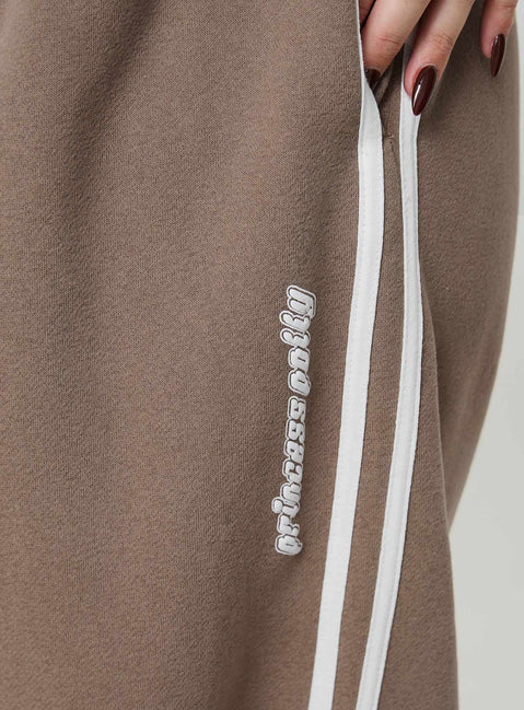 back view of model wearing Princess Polly Princess Polly Track Pants Stripe Taupe / White Curve 