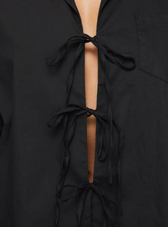 back view of model wearing Princess Polly Spiri Shirt Black Full Sleeves V-Neck 