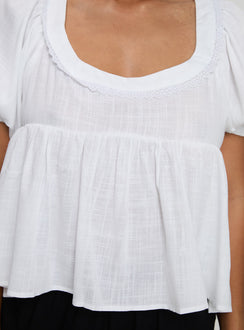 side view of model wearing Princess Polly Weyes Smock Top White Short Sleeves Scoop Neck 