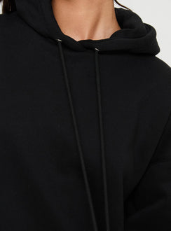 back view of model wearing Princess Polly Alvon Hooded Sweatshirt Black regular 