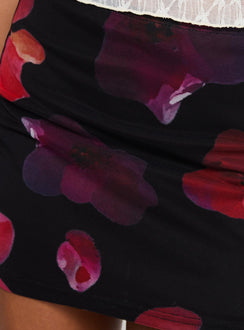 back view of model wearing Princess Polly Kennith Mini Skirt Black / Red Floral 