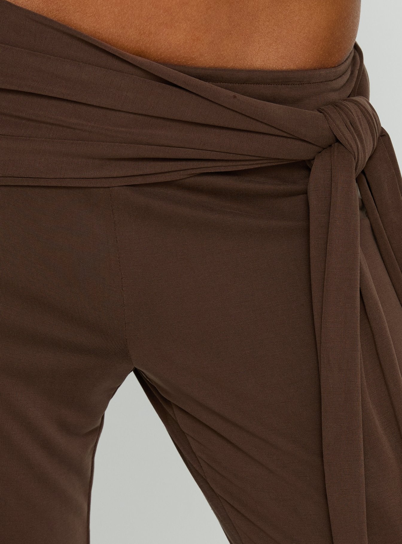back view of model wearing Princess Polly Katiana Wrap Jersey Pants Brown Mid Rise Pants 