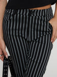 back view of model wearing Princess Polly Allude Low Waist Pinstripe Pant Black Low Rise Pants 