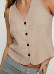 Knit vest top V-neckline, button fastening down front Good stretch, unlined 