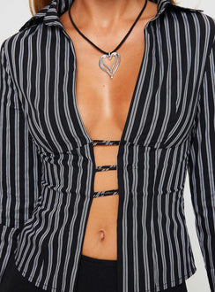 Front view of model wearing  front Princess Polly Full Sleeves Plunger  Nial Long Sleeve Top Black Stripe