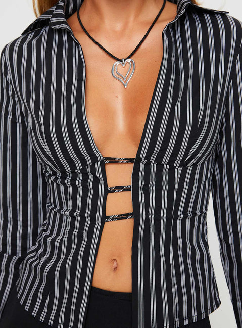 Front view of model wearing  front Princess Polly Full Sleeves Plunger  Nial Long Sleeve Top Black Stripe