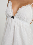 Mini dress V neckline, broderie material, adjustable shoulder straps, elastic band under bust Non-stretch, fully lined