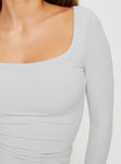 Long sleeve ribbed top with a scooped neckline Good stretch, lined body