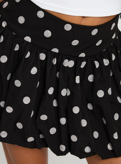 back view of model wearing Princess Polly Quintessa Bubble Hem Mini Skirt Black / White 