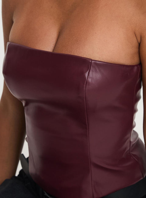 back view of model wearing Princess Polly Oaklee Strapless Faux Leather Top Burgundy Sleeveless straight 