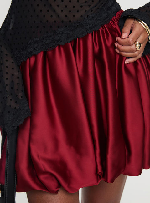 back view of model wearing Princess Polly Rubee Bubble Hem Mini Skirt Red Mini Skirts 