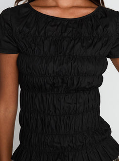 back view of model wearing Princess Polly Spoiler Alert Ruched Top Black Short Sleeves Scoop Neck 