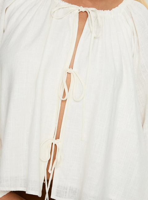 back view of model wearing Princess Polly Somebody Else Tie Up Top White Full Sleeves Crew Neck 