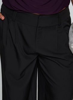 side view of model wearing Princess Polly Two Lovers Low Rise Pants Black Curve Low Rise Pants 