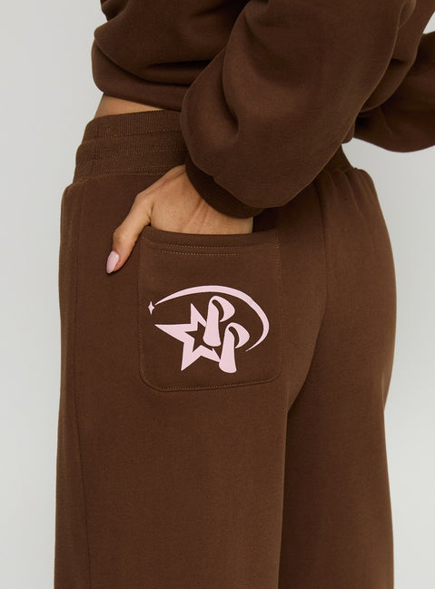 side view of model wearing Princess Polly Princess Polly Stargirl Wide Leg Sweat Pants Brown High Rise Pants 
