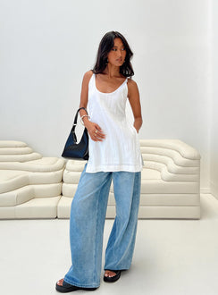 Front view of model wearing  front Princess Polly Sleeveless Crew Neck  Zanzibar Top White