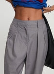 side view of model wearing Princess Polly Expertise Low Rise Pleat Pant Grey High Waisted Pants 